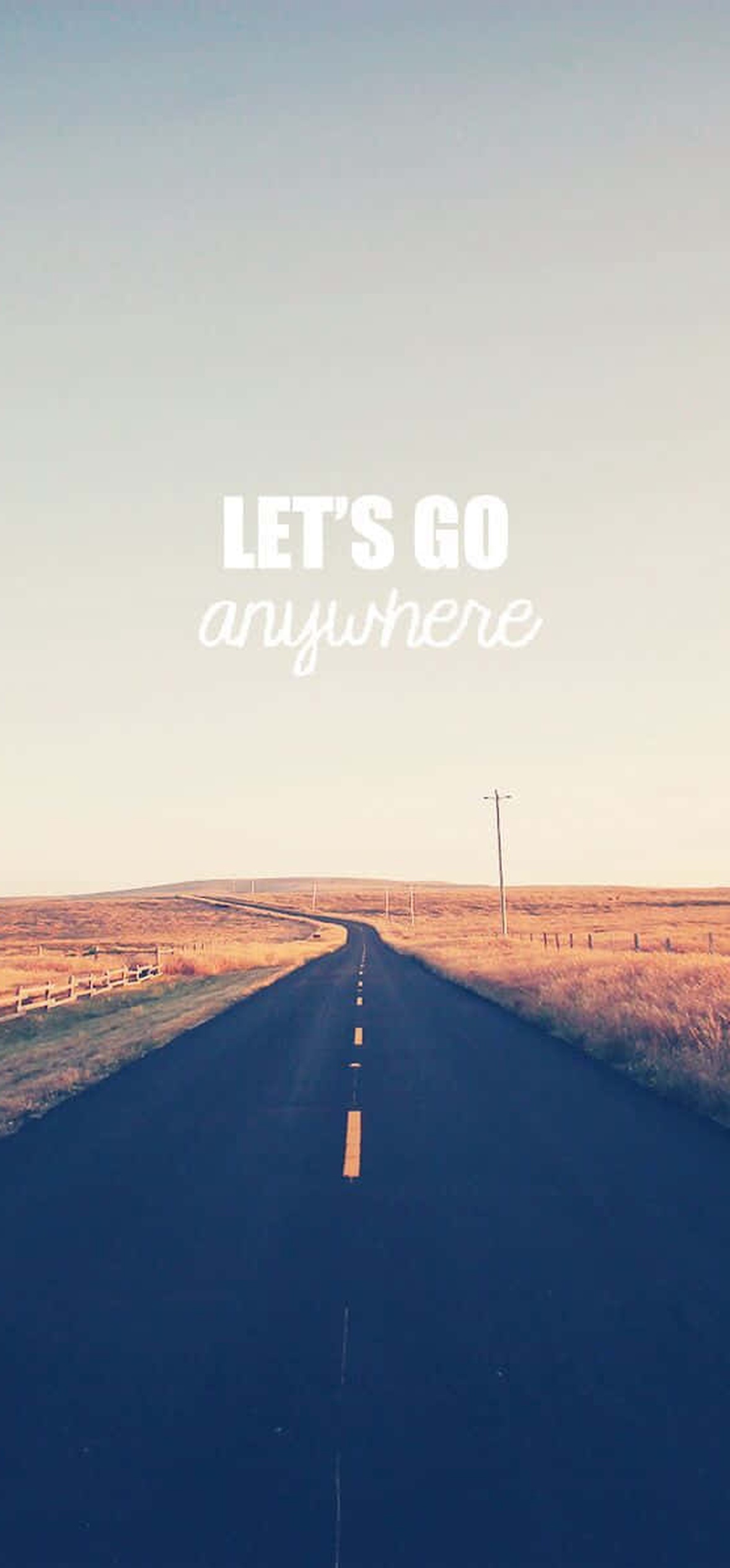 A long road through grasslands with text saying let's go anywhere