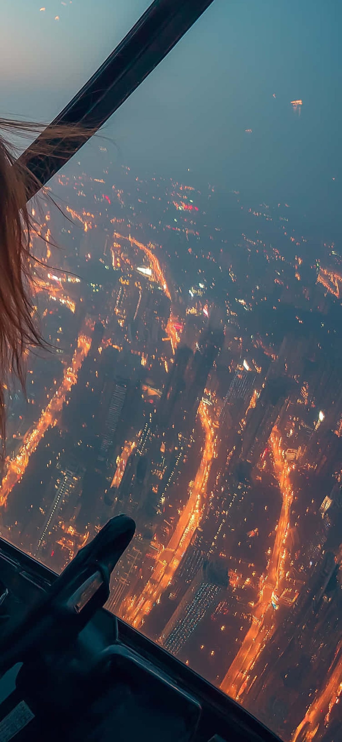 Woman In A Helicopter Flying Over A City Skyline At Night – Ultra HD iPhone 18 Landscape Wallpapers