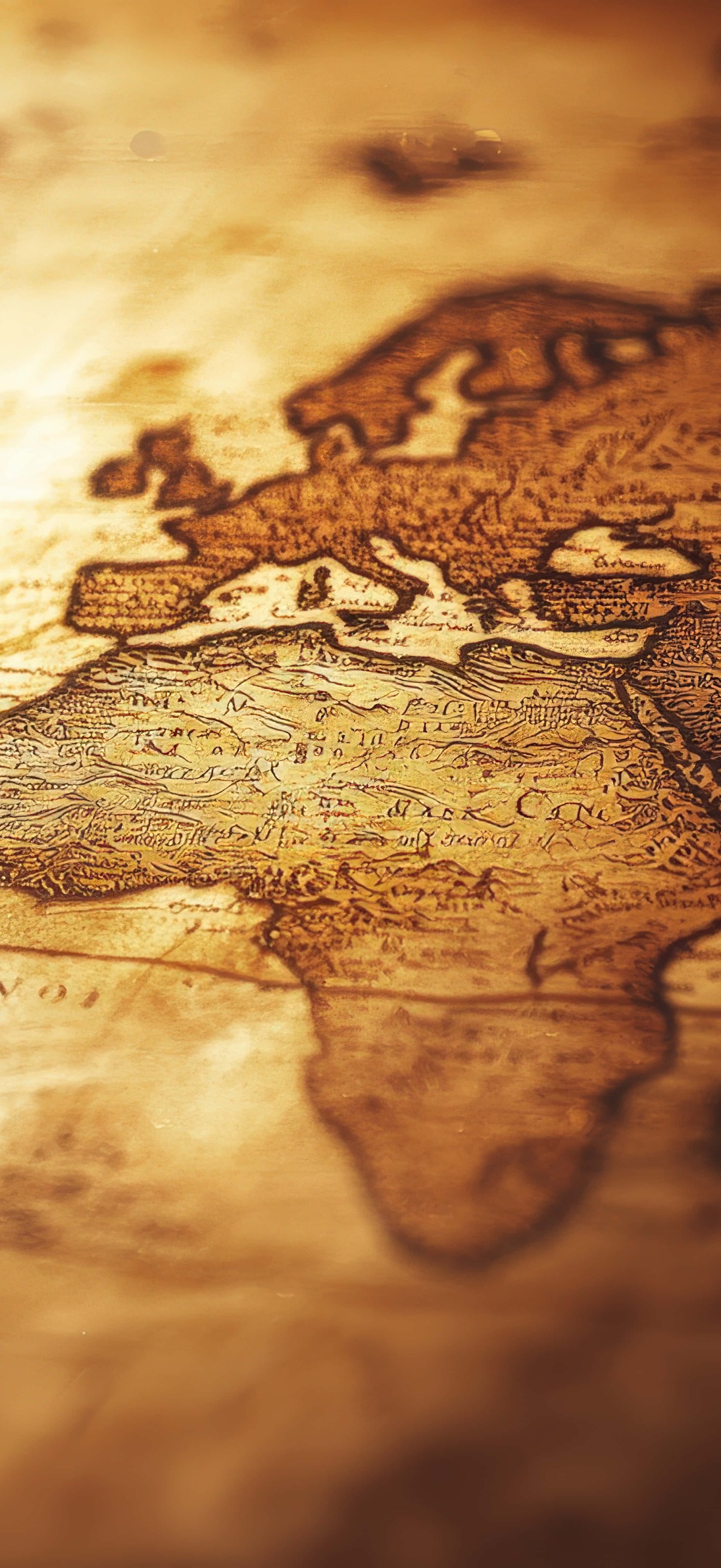 Aged world map with intricate details illuminated by warm light – Ultra HD iPhone 18 Landscape Wallpapers